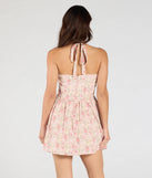 Make a bold statement in the Twirling Beauty Halter Floral Skater Dress in pink, the perfect spring dress for weddings, cocktail hours, nights out, and/or seasonal celebrations.