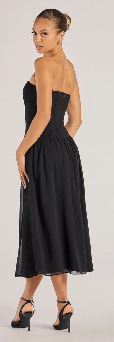 Revamp your 2025 wardrobe with this chic addition, the Stylish Moment Drop Waist A-Line Midi Dress in black, perfect for elevating your style in the new year.
