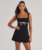 Step into winter chic with the So Adored Sleeveless Bow Trim Crepe Mini Dress, a black mini dress featuring an above-the-knee cut ideal for cocktail parties, festive gatherings, or clubwear.