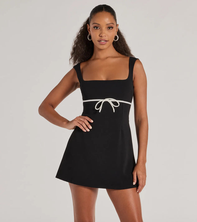 Step into winter chic with the So Adored Sleeveless Bow Trim Crepe Mini Dress, a black mini dress featuring an above-the-knee cut ideal for cocktail parties, festive gatherings, or clubwear.