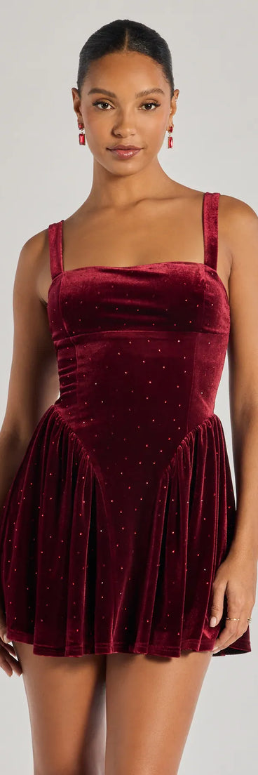 The Flawless Glamour Rhinestone Velvet Skater Dress in wine is a modern red dress featuring trendy details and a stunning design ideal for wedding guest dresses, elegant cocktail looks, or a stunning grad dress.
