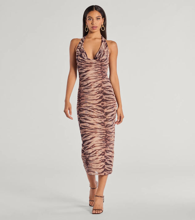 Make a bold statement in the Sultry And Sassy Zebra Print Halter Midi Dress in brown, the perfect spring dress for weddings, cocktail hours, nights out, and/or seasonal celebrations.