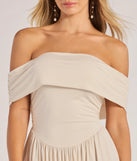 The Compelling Romantic Off-The-Shoulder Pleated Maxi Dress in ivory brings edge and energy to your vibe, ready to elevate any festival look or concert outfit.