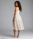 The Effortless Love Ruffled Floral Chiffon Midi Dress in natural brings sleek style to any graduation outfit, from cap and gown to after-party.