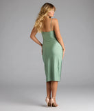 The Sleek And Smooth High Slit Midi Dress in sage green brings sleek style to any graduation outfit, from cap and gown to after-party.