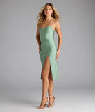The Sleek And Smooth High Slit Midi Dress in sage green brings sleek style to any graduation outfit, from cap and gown to after-party.