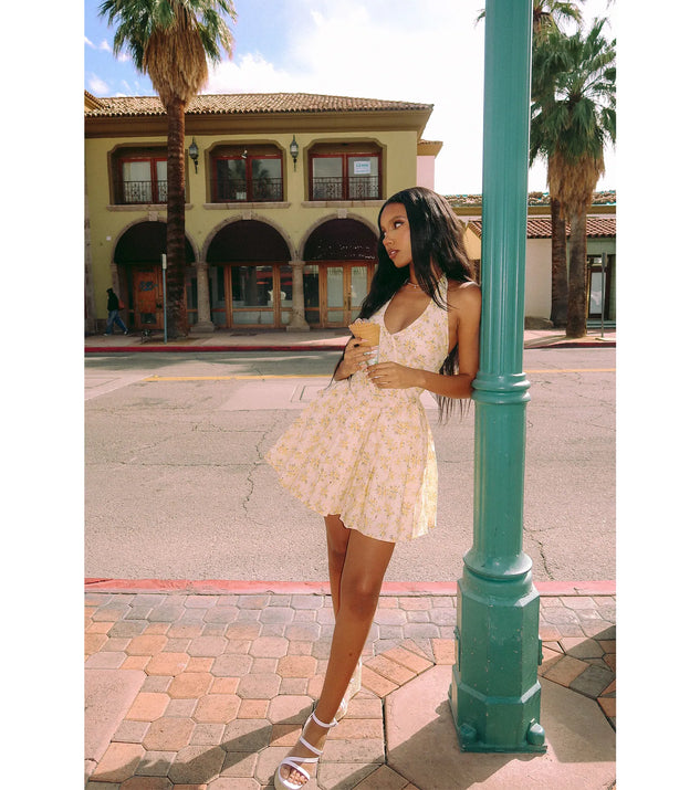 The Dressing For Sunshine Halter Floral Skater Dress in ivory brings sleek style to any graduation outfit, from cap and gown to after-party.