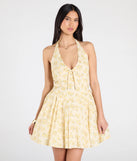 Feel confident and photo-ready in the Dressing For Sunshine Halter Floral Skater Dress, a ivory graduation dress perfect for 2025 ceremonies and parties.