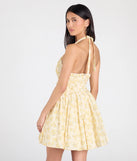 The Dressing For Sunshine Halter Floral Skater Dress in ivory brings sleek style to any graduation outfit, from cap and gown to after-party.