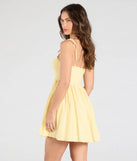 The Sunny Tones Smocked Eyelet Skater Dress in yellow brings sleek style to any graduation outfit, from cap and gown to after-party.