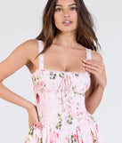 Make a bold statement in the Tea Time Corset Lace-Up Floral Skater Dress in pink, the perfect spring dress for weddings, cocktail hours, nights out, and/or seasonal celebrations.