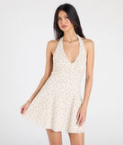 Step into milestone moments with the Blissful Cutie Halter Button Floral Skater Dress, a standout in ivory dresses perfect for birdal showers, Easter celebrations, and 2025 grad looks.