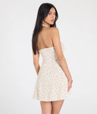 Make a bold statement in the Blissful Cutie Halter Button Floral Skater Dress in ivory, the perfect spring dress for weddings, cocktail hours, nights out, and/or seasonal celebrations.