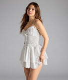 Feel confident and photo-ready in the Park Picnic V-Neck Eyelet Skater Dress, a white graduation dress perfect for 2025 ceremonies and parties.