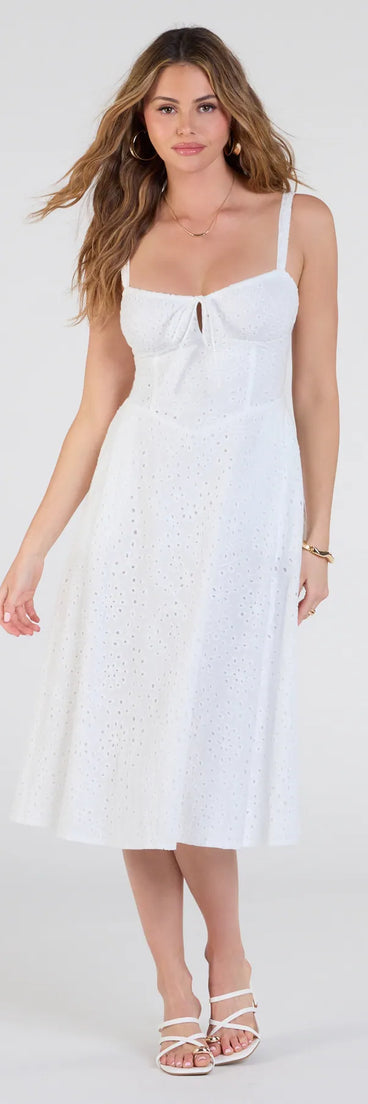 Feel confident and photo-ready in the Sunny Staple Square Neck Eyelet Midi Dress With Pockets, a white graduation dress perfect for 2025 ceremonies and parties.