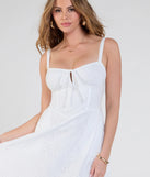 The Sunny Staple Square Neck Eyelet Midi Dress With Pockets in white brings sleek style to any graduation outfit, from cap and gown to after-party.