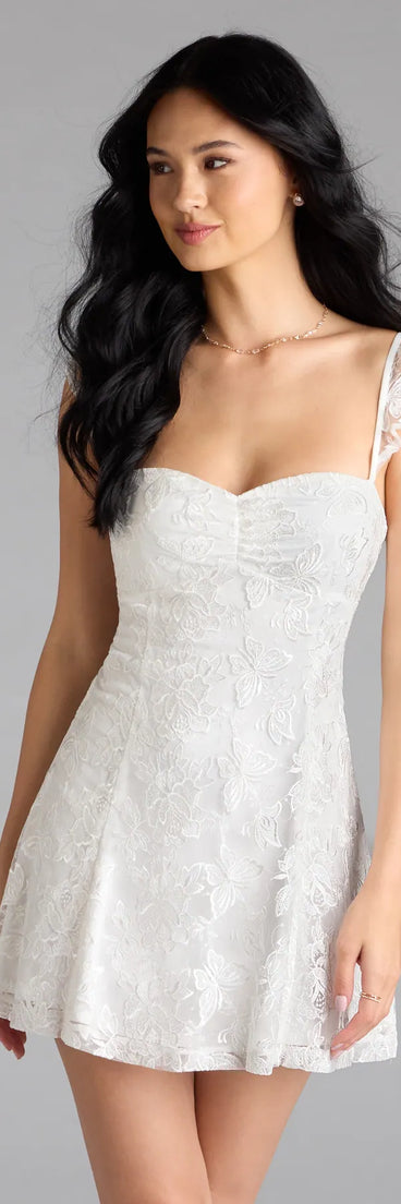 Shine with confidence, elegance, and standout style in the Enchanting Impression Butterfly Lace-Up Skater Dress—a white graduation dress designed with a fresh silhouette and the latest trends.