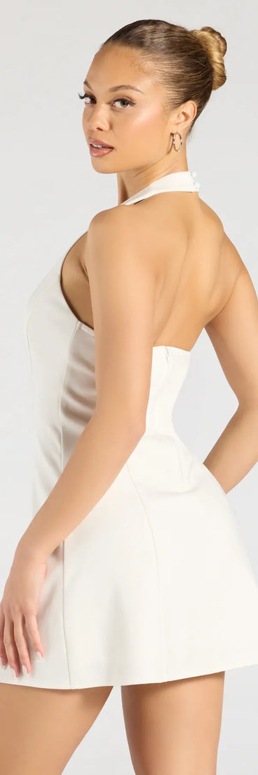 The Chic Event Halter A-Line Mini Dress in white brings sleek style to any graduation outfit, from cap and gown to after-party.