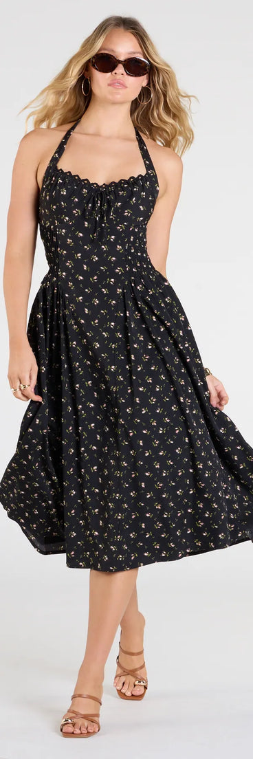 Soak up the season in the Set The Tone Halter A-Line Floral Midi Dress, a black sundress styled for easy days, outdoor plans, and everything in between.