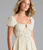 Feel confident and photo-ready in the Dearest Charm Bow Print Skater Dress, a natural graduation dress perfect for 2025 ceremonies and parties.