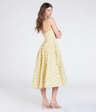 Make a bold statement in the Set For Spring Halter Corset Floral Midi Dress in yellow, the perfect spring dress for weddings, cocktail hours, nights out, and/or seasonal celebrations.