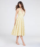 Make a bold statement in the Set For Spring Halter Corset Floral Midi Dress in yellow, the perfect spring dress for weddings, cocktail hours, nights out, and/or seasonal celebrations.