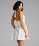 The Sweet Silhouette Drop Waist Skater Dress in white brings sleek style to any graduation outfit, from cap and gown to after-party.