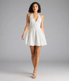 The Sweet Silhouette Drop Waist Skater Dress in white brings sleek style to any graduation outfit, from cap and gown to after-party.