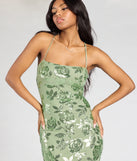 Make a bold statement in the Touch Of Glamour Lace-Up Floral Sequin Midi Dress in sage green, the perfect green dress for weddings, cocktail hours, nights out, and/or seasonal celebrations.