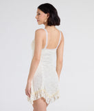 The Desert Sun Lace Ruffle Mini Dress in ivory brings sleek style to any graduation outfit, from cap and gown to after-party.