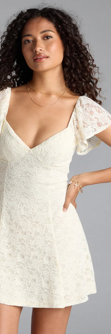 Soak up the season in the Romantic Allure Flutter Sleeve A-Line Lace Mini Dress, a ivory sundress styled for easy days, outdoor plans, and everything in between.