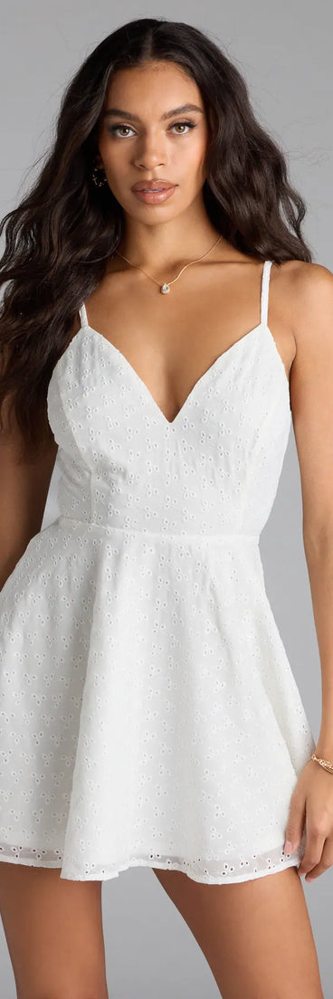 Soak up the season in the Cute Thing Tie-Back Eyelet Skater Dress, a white sundress styled for easy days, outdoor plans, and everything in between.