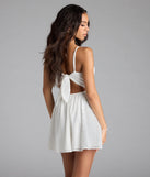 The Cute Thing Tie-Back Eyelet Skater Dress in white brings sleek style to any graduation outfit, from cap and gown to after-party.