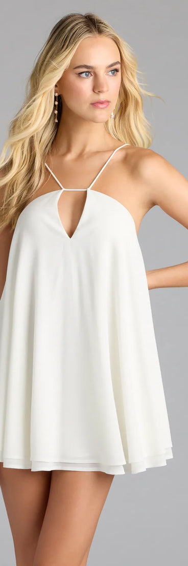 Step into summer looking effortlessly chic in the Feelin' Sweet Chiffon Halter Babydoll Dress in ivory, a must-have Windsor dress for your warm-weather wardrobe.