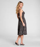 Whether you're headed to brunch or running errands, the Thriving Blooms Corset Floral Slit Midi Dress in black delivers effortless style in a breathable, go-to casual dress.
