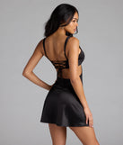 Step into summer looking effortlessly chic in the Breathtaking View Lace Up A-Line Satin Mini Dress in black, a must-have Windsor dress for your warm-weather wardrobe.