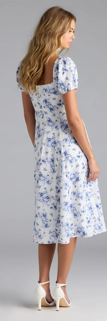 The Charmingly Perfect Floral A-Line Midi Dress in white features a flattering fit and mid-calf hem, redefining effortless midi dresses for any occasion.