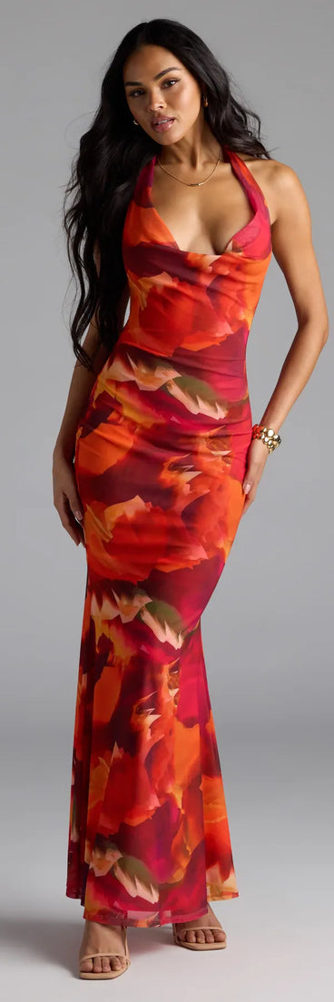 Step into summer looking effortlessly chic in the Island Style Tropical Halter Mesh Maxi Dress in orange, a must-have Windsor dress for your warm-weather wardrobe.