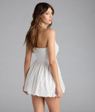 Shine with confidence, elegance, and standout style in the Effortless Eyelet Bubble Hem Mini Dress—a white graduation dress designed with a fresh silhouette and the latest trends.