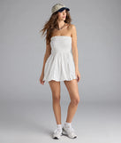Shine with confidence, elegance, and standout style in the Effortless Eyelet Bubble Hem Mini Dress—a white graduation dress designed with a fresh silhouette and the latest trends.