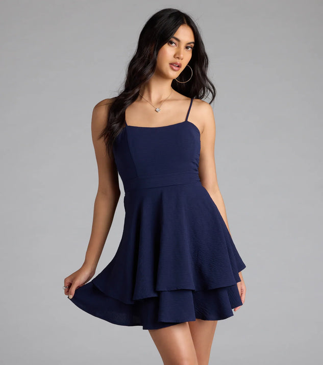 Shine with confidence, elegance, and standout style in the Lovely Day Tie Back Ruffle Skater Dress—a navy blue graduation dress designed with a fresh silhouette and the latest trends.