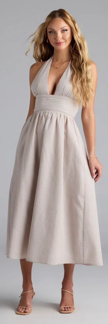 Feel instantly put-together in the Cup Of Tea Striped Halter Midi Dress With Pockets in natural, a stylish wedding guest dress designed for confident style and all-out celebration.