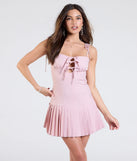 Make a bold statement in the Simply Cute Tie Front Pleated Mini Dress in pink, the perfect spring dress for weddings, cocktail hours, nights out, and/or seasonal celebrations.