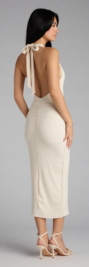 The Chic Cutie Ribbed Knit Halter Midi Dress in ivory features a flattering fit and mid-calf hem, redefining effortless midi dresses for any occasion.