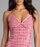 Soak up the season in the Girly Gingham Print Ruffled Mini Dress, a red sundress styled for easy days, outdoor plans, and everything in between.
