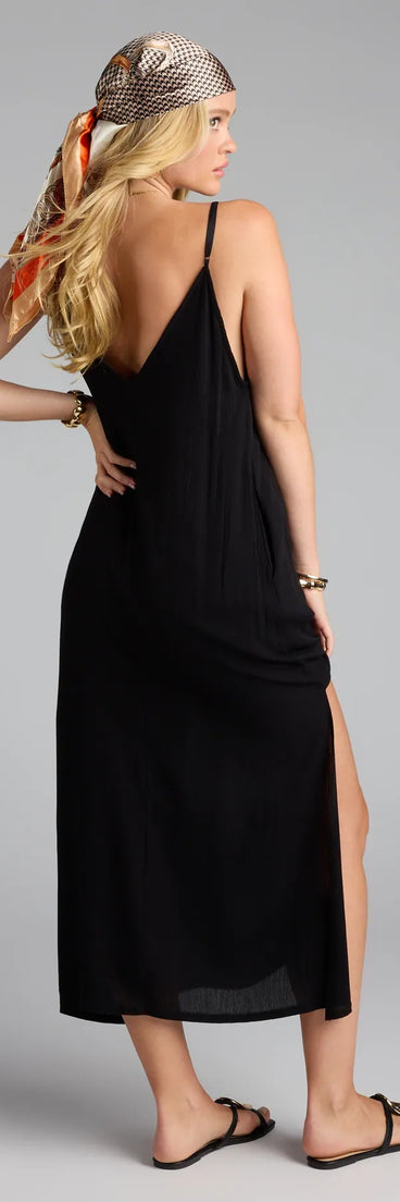 The Casual Fave Flowy V-Neck Midi Dress in black features a flattering fit and mid-calf hem, redefining effortless midi dresses for any occasion.