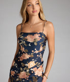 The Flirt Alert Floral Slit Midi Dress in navy blue features a flattering fit and mid-calf hem, redefining effortless midi dresses for any occasion.