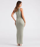 The Casual Cool Girl High Slit Ribbed Knit Maxi Dress is a cozy sweater dress made from soft, stretchy fabric, perfect for layering on chilly winter days or dressing up as a warm holiday dress.