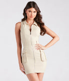 Step into seasonal chic with the All The Attention Collared Cargo Mini Dress, a brown mini dress featuring an above-the-knee cut ideal for cocktail parties, festive gatherings, or clubwear.