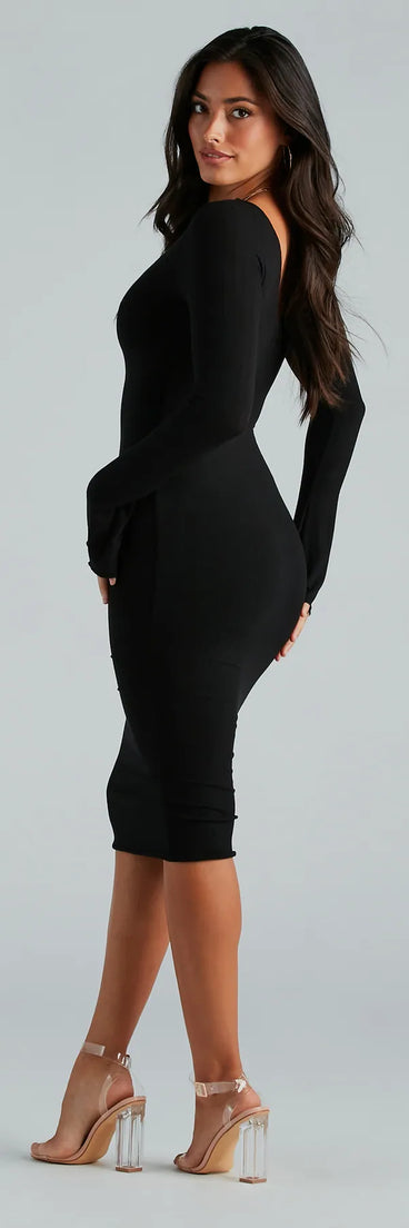 The Cute In The City V-Neck Knit Midi Dress is a cozy sweater dress made from soft, stretchy fabric, perfect for layering on chilly winter days or dressing up as a warm holiday dress.